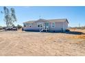 Inviting single-story home with well-kept facade surrounded by natural landscape at 38203 W Willetta St, Tonopah, AZ 85354