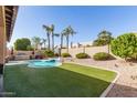 Beautiful backyard showcasing a private pool, well-maintained turf, and ample lounge space at 4502 E Meadow Dr, Phoenix, AZ 85032