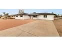 Inviting single-story home with xeriscaped front and driveway at 556 E Manor Dr, Casa Grande, AZ 85122