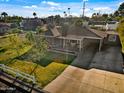 Aerial view of a well-maintained home featuring a spacious yard, and mature landscaping at 6704 N 10Th Pl, Phoenix, AZ 85014