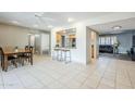 Open-concept living space showcasing tile floors, a kitchen pass-through, and a spacious dining area at 7629 N Via De La Campana --, Scottsdale, AZ 85258