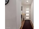 Bright entryway with a modern front door and wood-look tile flooring at 13224 W Crimson Ter, Peoria, AZ 85383