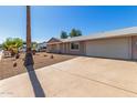 Single-story home featuring a two-car garage and low-maintenance desert landscaping at 13232 N 40Th Pl, Phoenix, AZ 85032