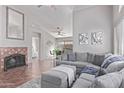 Spacious living room featuring a fireplace, comfortable seating, and neutral decor at 13425 N 92Nd Pl, Scottsdale, AZ 85260