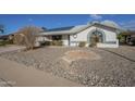 Charming single-story home featuring a two-car garage and low-maintenance desert landscaping at 13914 W Terra Vista Dr, Sun City West, AZ 85375