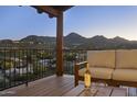 Inviting outdoor patio seating with wrought iron railing and serene mountain views perfect for entertaining at 15101 E Aspen Dr, Fountain Hills, AZ 85268