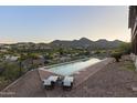 Relaxing poolside with scenic mountain views and comfortable lounge chairs creating the perfect outdoor oasis at 15101 E Aspen Dr, Fountain Hills, AZ 85268