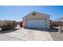 Attached single-car garage with a well maintained driveway and walkway at 2803 W Angela Dr, Phoenix, AZ 85053