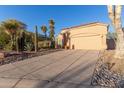 Property boasting low-maintenance landscaping, an extra-wide driveway, and a neutral color scheme at 3055 N Red Mtn # 178, Mesa, AZ 85207