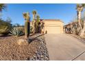 Inviting home featuring drought-tolerant landscaping, a paved driveway, and an attached two car garage at 3055 N Red Mtn # 178, Mesa, AZ 85207