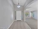 Inviting entryway featuring a decorative light fixture and tile flooring at 3129 W Walter Way, Phoenix, AZ 85027
