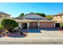 Charming single-story home with a well-manicured front yard and a spacious three-car garage at 3129 W Walter Way, Phoenix, AZ 85027