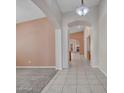 Bright hallway with tiled flooring that leads to other rooms in the house at 3129 W Walter Way, Phoenix, AZ 85027