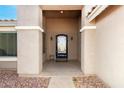 Inviting front entrance with a decorative iron door and a covered porch at 3608 N Mansfield Dr, Litchfield Park, AZ 85340