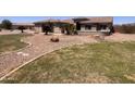 Lush, green front yard with desert landscaping features manicured lawn and stone accents at 3608 N Mansfield Dr, Litchfield Park, AZ 85340