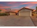 Single-story home featuring a private driveway and mature desert landscaping at 4165 W Park Ave, Chandler, AZ 85226