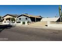 Picture featuring the house and low desert landscaping showcasing its unique design at 4836 W Redfield Rd, Glendale, AZ 85306