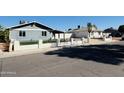 Street view capturing cozy homes with desert landscaping, and secure fences for outdoor enjoyment at 4836 W Redfield Rd, Glendale, AZ 85306