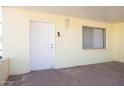 Inviting covered porch with brick flooring, a secure white door and a side window for natural light at 5907 N Azalia St, Casa Grande, AZ 85122