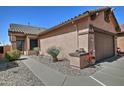 Single level home with desert landscaping, gravel, and a two car garage at 8176 S Pioneer Ct, Gold Canyon, AZ 85118