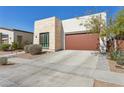 Modern home with a desert landscaped front yard and a spacious concrete driveway at 942 E Paseo Way, Phoenix, AZ 85042