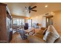 Spacious living room features tile flooring, ceiling fan, and a comfortable seating arrangement at 9513 W Cottonwood Dr, Sun City, AZ 85373