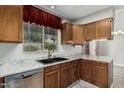Beautiful kitchen featuring stainless steel appliances, wood cabinets, and granite countertops at 1016 E Utopia Rd, Phoenix, AZ 85024