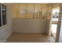 Inviting covered porch with lattice siding offering privacy and shade at 10621 N 115Th Ave, Youngtown, AZ 85363