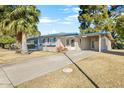 Well-maintained home with covered parking, drought-resistant landscaping, and inviting curb appeal at 10922 W Peoria Ave, Sun City, AZ 85351