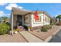 Attractive home with a welcoming entrance, charming landscaping, and an inviting facade at 11596 W Sierra Dawn Blvd # 278, Surprise, AZ 85378