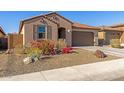 Charming single-story home featuring a tiled roof and a well-maintained desert landscape at 12344 E Soloman Rd, Gold Canyon, AZ 85118