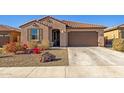 Charming single-story home featuring a tiled roof and a well-maintained desert landscape at 12344 E Soloman Rd, Gold Canyon, AZ 85118