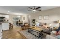 Open-concept living room and dining area with lots of natural light and stylish furniture at 14436 N 34Th Pl, Phoenix, AZ 85032