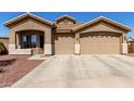 Charming single story home with a two car garage and well maintained desert landscaping at 14846 N 145Th Ave, Surprise, AZ 85379