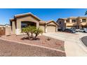 Charming single story home with a two car garage and well maintained desert landscaping at 14846 N 145Th Ave, Surprise, AZ 85379
