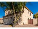 Exterior elevation of home's back side with block wall and desert landscaping at 16189 N 137Th Dr, Surprise, AZ 85374