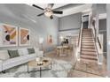 Open-concept living room flows into dining area, featuring neutral tones and tile flooring at 1718 S Longmore -- # 41, Mesa, AZ 85202