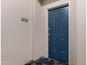 Unit 3016's front door showcasing new carpet and baseboards that offer a fresh, modern entrance at 2989 N 44Th St # 3016, Phoenix, AZ 85018