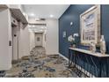 Well-maintained hallway with elegant décor and elevator access provides a welcoming and sophisticated atmosphere at 2989 N 44Th St # 3016, Phoenix, AZ 85018