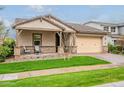 Attractive single-story house with a covered porch and a neatly landscaped front yard at 3563 E Austin Dr, Gilbert, AZ 85296