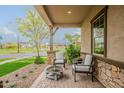 Cozy front porch with comfortable seating and a charming fire pit area at 3563 E Austin Dr, Gilbert, AZ 85296