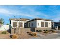 Charming single-story home with modern architecture and drought-resistant landscaping at 40195 N Hailey Ln, Queen Creek, AZ 85140