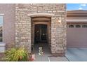 Charming front porch with a stone facade, and a landscaped garden at 4511 E Narrowleaf Dr, Gilbert, AZ 85298