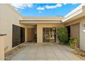 Charming courtyard featuring desert landscaping, tiled flooring, and multiple entryways into the residence at 4525 N 66 St # 56, Scottsdale, AZ 85251