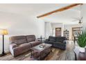 The living room features wood laminate flooring and a view of the home's entry at 4530 W Continental Dr, Glendale, AZ 85308
