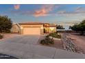 Charming single-Gathering home with a well-maintained front yard and a two-car garage at 4937 S Peach Willow Ln, Gilbert, AZ 85298