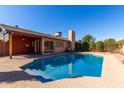 Backyard pool with patio, perfect for outdoor entertaining and relaxation at 5710 W Evergreen Rd, Glendale, AZ 85302