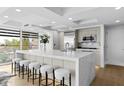Modern open kitchen featuring a large island, stainless steel appliances, seating and an abundance of natural light at 7137 E Rancho Vista Dr # 5001, Scottsdale, AZ 85251