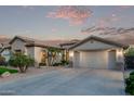Beautiful single-Gathering home boasting a well-manicured lawn, desert landscaping, and a spacious two-car garage at 7223 W Saddlehorn Rd, Peoria, AZ 85383