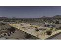 Expansive horse property, highlighted by boundary lines and featuring covered stalls and a central building at 9066 N Thunderbird Rd, Maricopa, AZ 85139